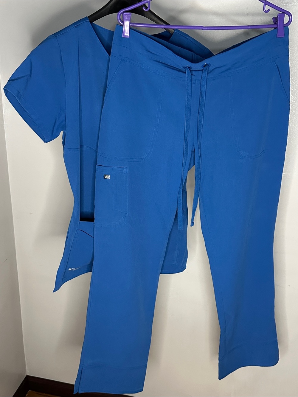 Grey’s Anatomy Women’s by Barco Signature Empire Wrap Scrub Top in Royal Blue - Picture 2 of 5